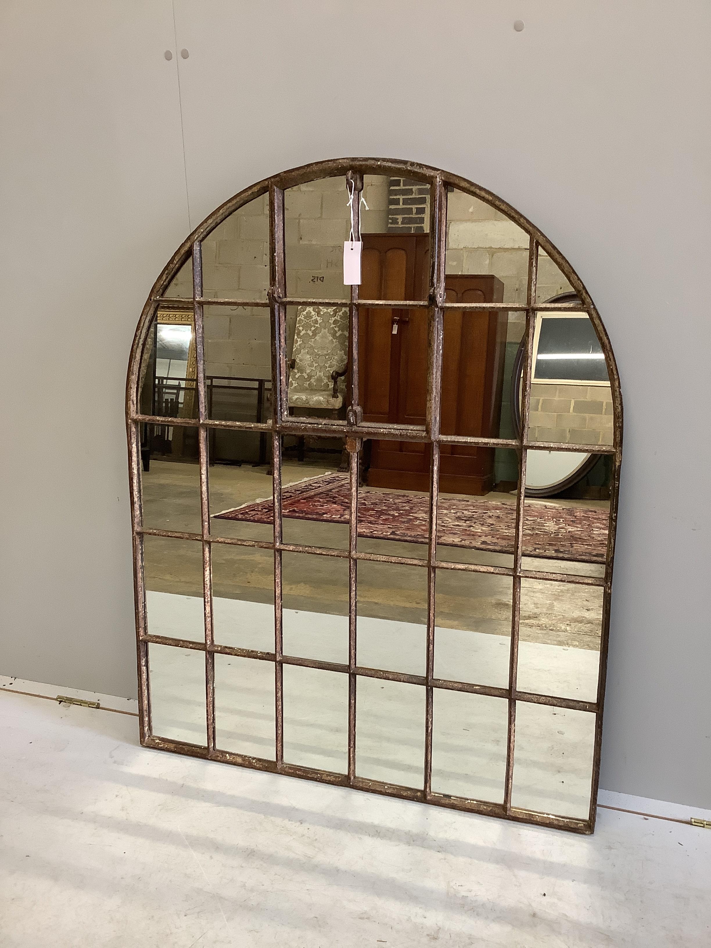 An industrial style cast iron arched window wall mirror, width 92cm, height 115cm